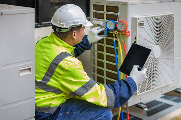Professional Air Conditioning Repair technician working in Camp H M Smith, HI